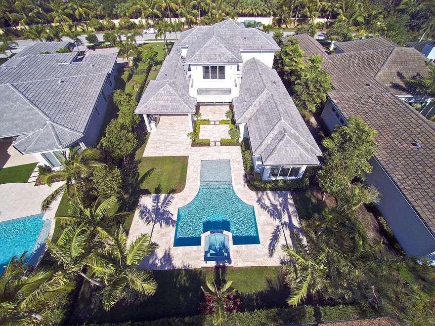 Just Reduced $200,000! Premier location with spectacular views of the golf course and water in the new Isle Estates section of Old Palm Golf Club.  The 1/3 acre homesite offers stunning golf course and lake views.  This estate home was purchased new in October 2017. Expansive covered lanai, summer kitchen with built-in BBQ, custom heated pool and spa, and lush tropical landscaping make this home ideal for outside entertaining.