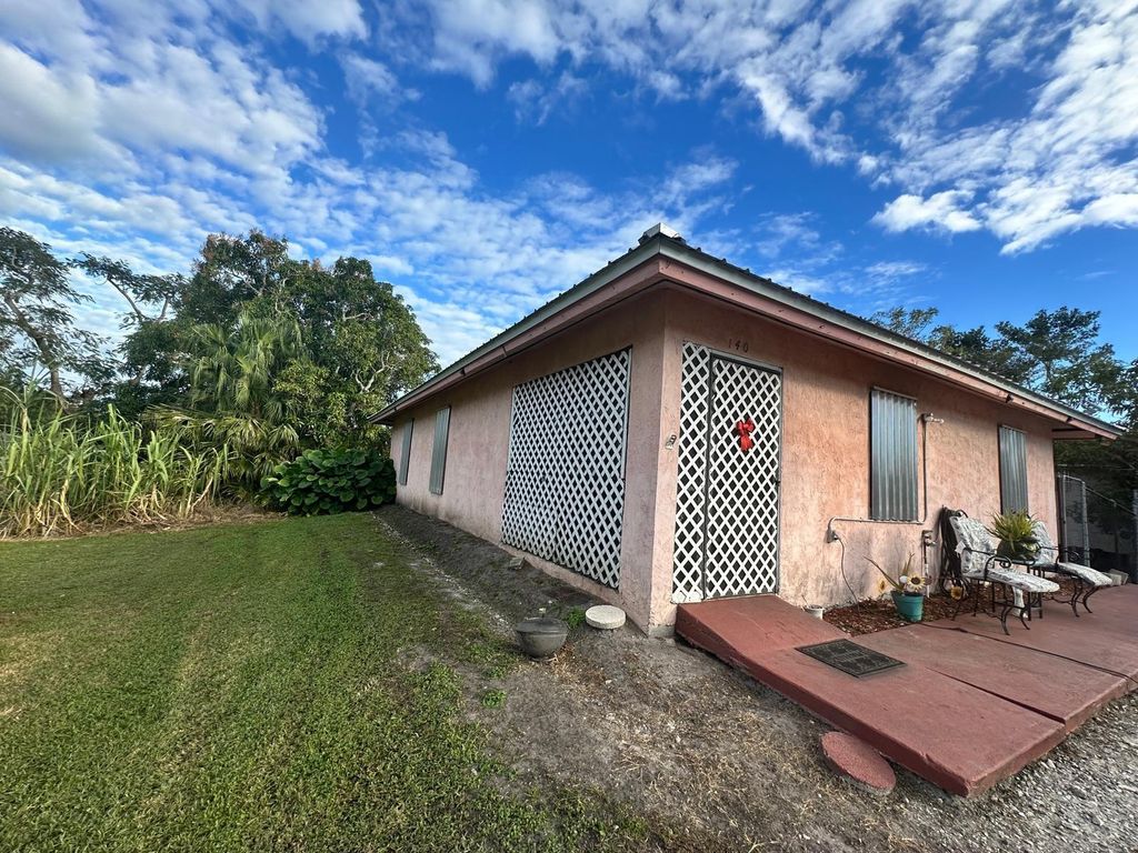Photo of 140 Banyan Avenue, Pahokee, FL 33476 (MLS # F10475020)