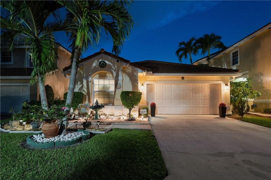 Welcome home to your beautiful piece of paradise w a split bedroom floor plan, both family/great room & living room. Owners spared absolutely no expense, breathtaking w every sweet nook taken care of! New roof, new impact windows, new water heater &  a/c w FPL power surge protection & allergy technology installed in A/C for those w allergies/asthma. Kitchen completely renovated w top quality cabinetry, lazy susan, cabinet lighting, coffee/tea station gorgeous countertop & top of the line appliances kitchen armoire & bar stools convey. Bathrooms completely remodeled & absolutely gorgeous, state of the art cabinetry w USB & outlet ports attached. Zen like front entry & back yard w summer kitchen. Low insurance, taxes, maint fees, great school surrounded by beautiful parks & anchored plazas.