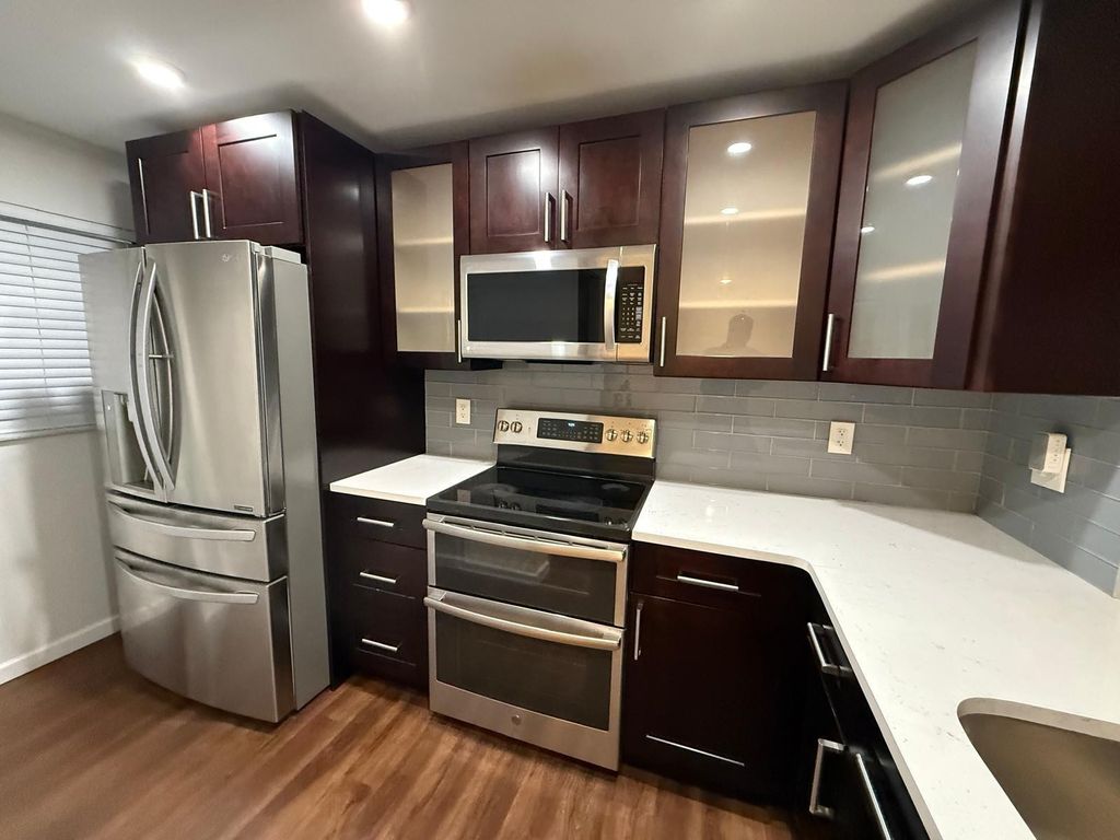 Photo of 9480 Poinciana Place #410, Davie, FL 33324 (MLS # B26017943)