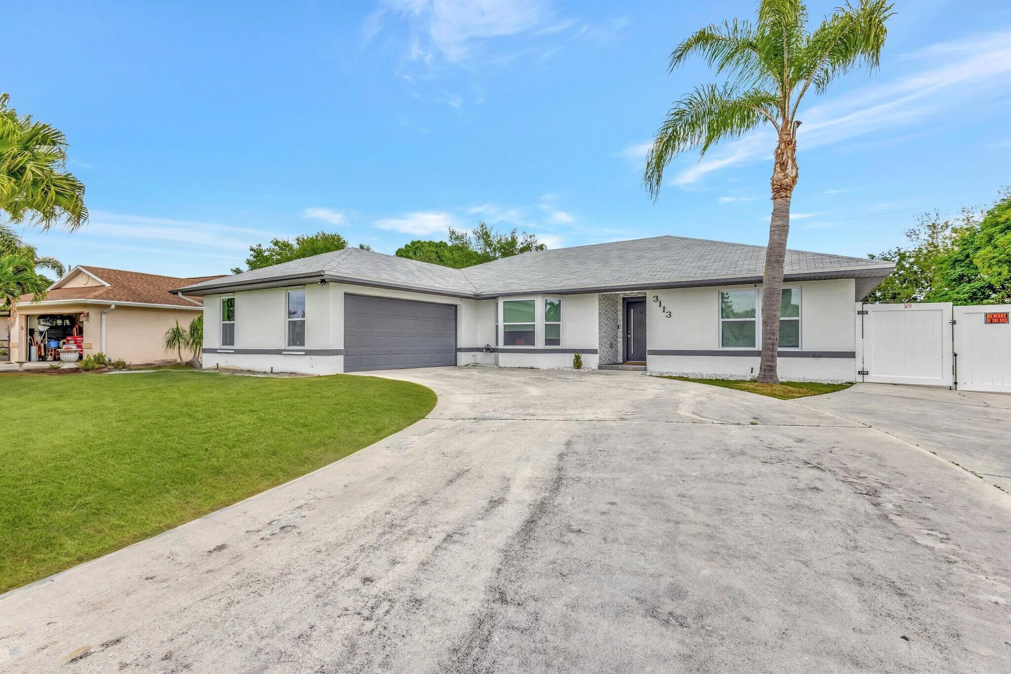 This beautifully renovated pool home is situated on an oversized lot in one the best neighborhoods in PSL. It features a new roof and pool, both completed in 2023. For added privacy, there's a new white vinyl fence with a double gate, ensuring easy access for your RV or boat. The property boasts all-new impact windows, solar panels, & gourmet kitchen equipped with quartz countertops, high-end appliances, a spacious pantry, and luxury cabinetry. Enjoy new flooring throughout, a lavish primary bath, and a remodeled 2nd bathroom. The half bath can easily be full bath. Formal dining area and a custom-built wine bar. Additionally, there's a bonus room ideal for a home office or in-law suite. Conveniently located near the marina, providing easy access to the boat dock and also nearby turnpike.