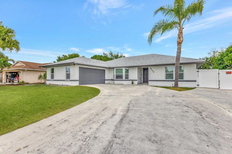 This beautifully renovated pool home is situated on an oversized lot in one the best neighborhoods in PSL. It features a new roof and pool, both completed in 2023. For added privacy, there's a new white vinyl fence with a double gate, ensuring easy access for your RV or boat. The property boasts all-new impact windows, solar panels, & gourmet kitchen equipped with quartz countertops, high-end appliances, a spacious pantry, and luxury cabinetry. Enjoy new flooring throughout, a lavish primary bath, and a remodeled 2nd bathroom. The half bath can easily be full bath. Formal dining area and a custom-built wine bar. Additionally, there's a bonus room ideal for a home office or in-law suite. Conveniently located near the marina, providing easy access to the boat dock and also nearby turnpike. The solar panels provide for very low electric bills averaging 125.00. The bonus room can additionally be used for play or game room. Don't miss out on this stunning home.