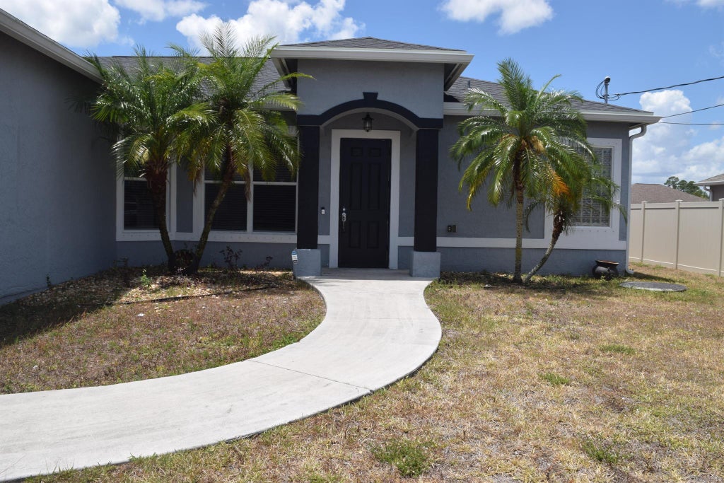 Photo of 4002 SW Jarmer Road, Port Saint Lucie, FL 34953 (MLS # R10983951)