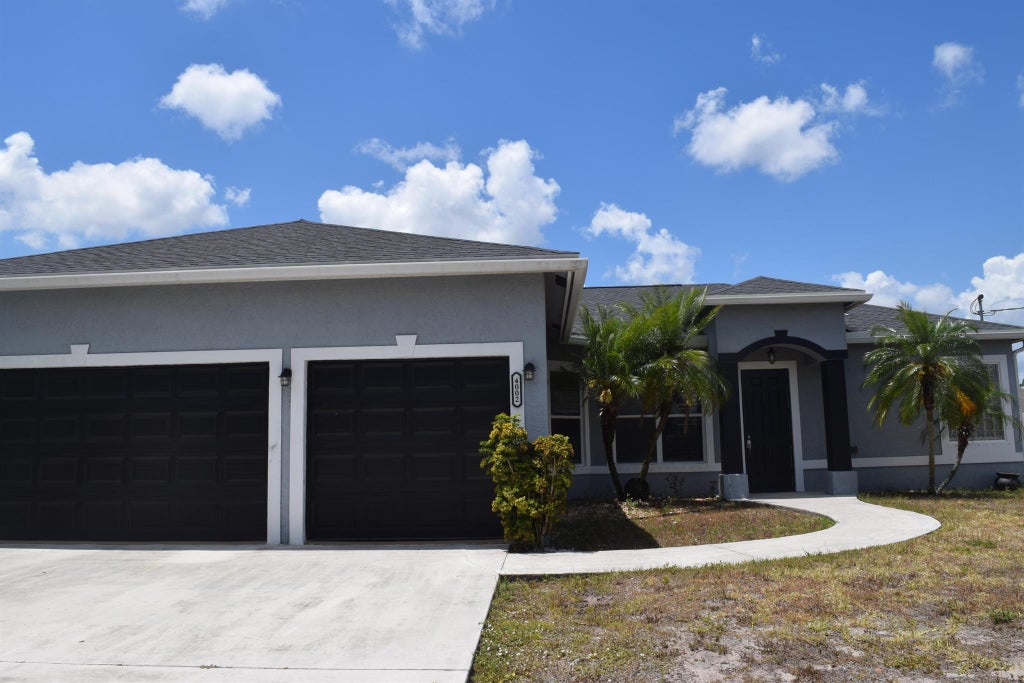 Photo of 4002 SW Jarmer Road, Port Saint Lucie, FL 34953 (MLS # R10983951)