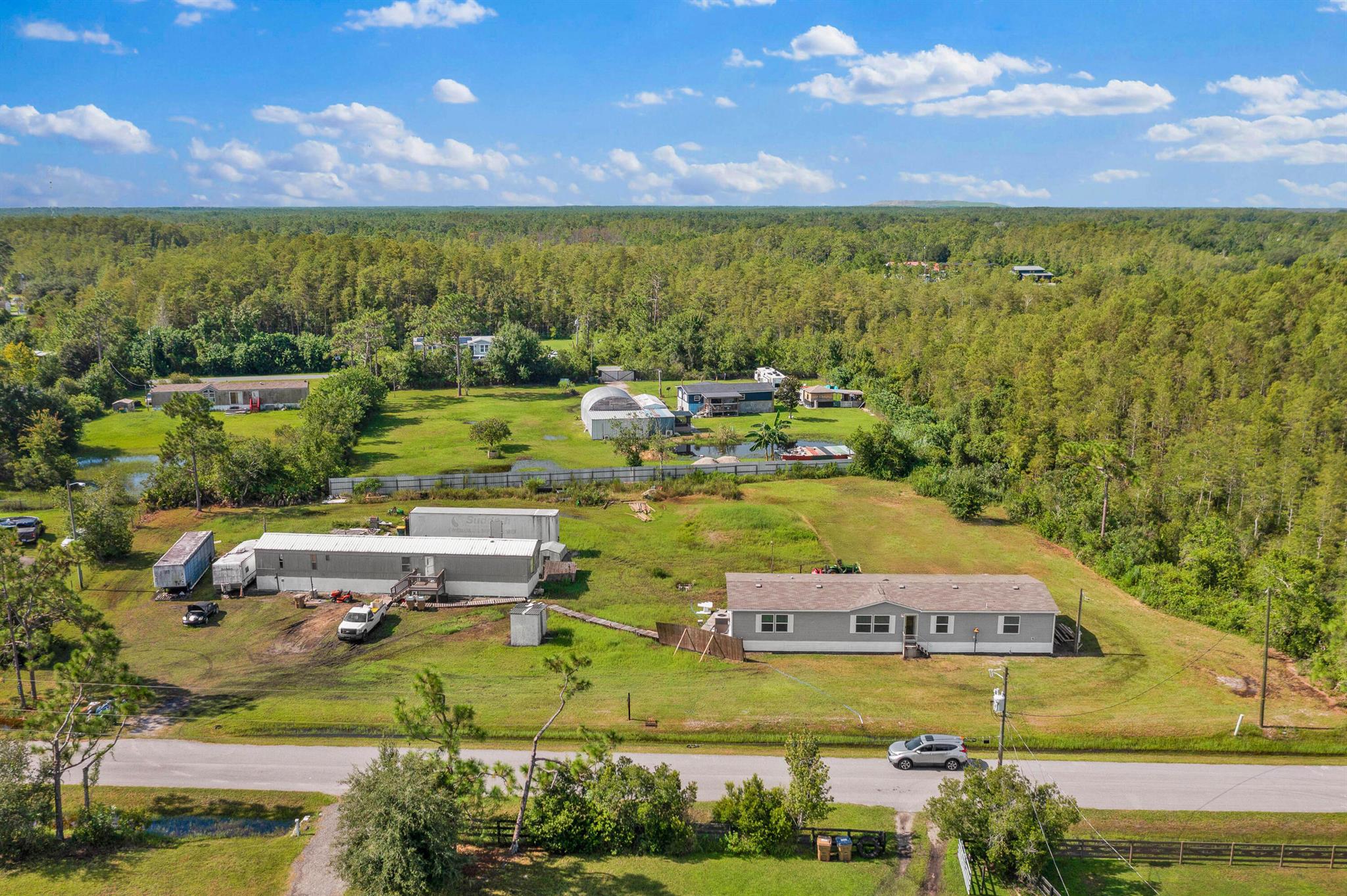 2 Homes on 1.3 Acres. Primary Home built in 2023- 5 Bed 3 Bath, Guest Home 3 Bed 2 Bath. No deed restrictions. Perfect for a multi-generational family household, Income producing rental or Air B&B. 1 hour Drive to Disney & Melbourne Beach. Easy access to amenities.