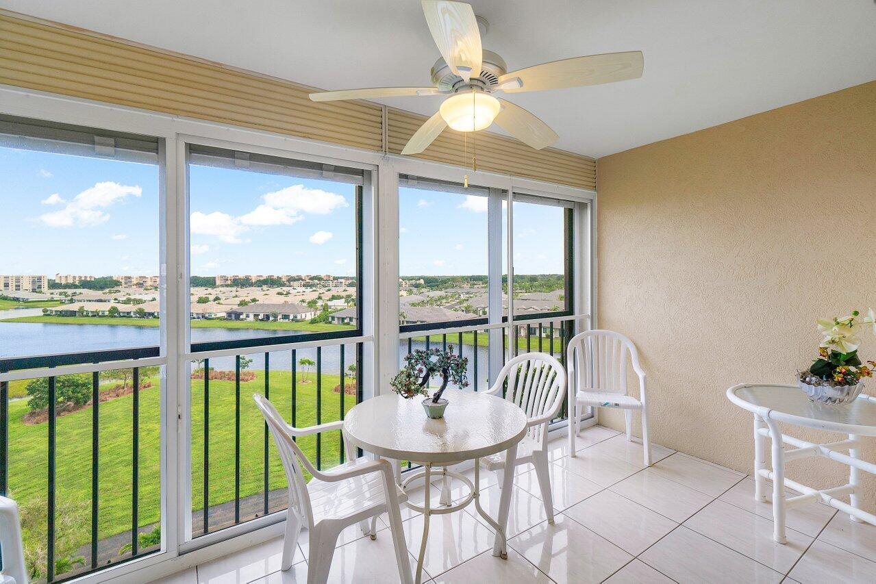 Welcome to this well maintained light & bright 2 bed/2-bath condo offering stunning water views from the enclosed balcony with an eastern exposure on the 7th floor, conveniently located near the elevator. Tiled floors throughout, plenty of closet space, and an in-unit washer/dryer for added convenience. Situated in a perfect location within the community, right across from the newly renovated clubhouse, which includes amenities such as indoor & outdoor pools, fitness center, 7 pickleball courts, 7 tennis courts, 3 Bocce Ball courts, state-of-the-art 650-seat theater, 350-seat ballroom, card rooms, and billiards. This very active 55+ community is located close to public transportation, places of worship, Publix, shopping centers, banks, restaurants, salons, movie theaters & library.
