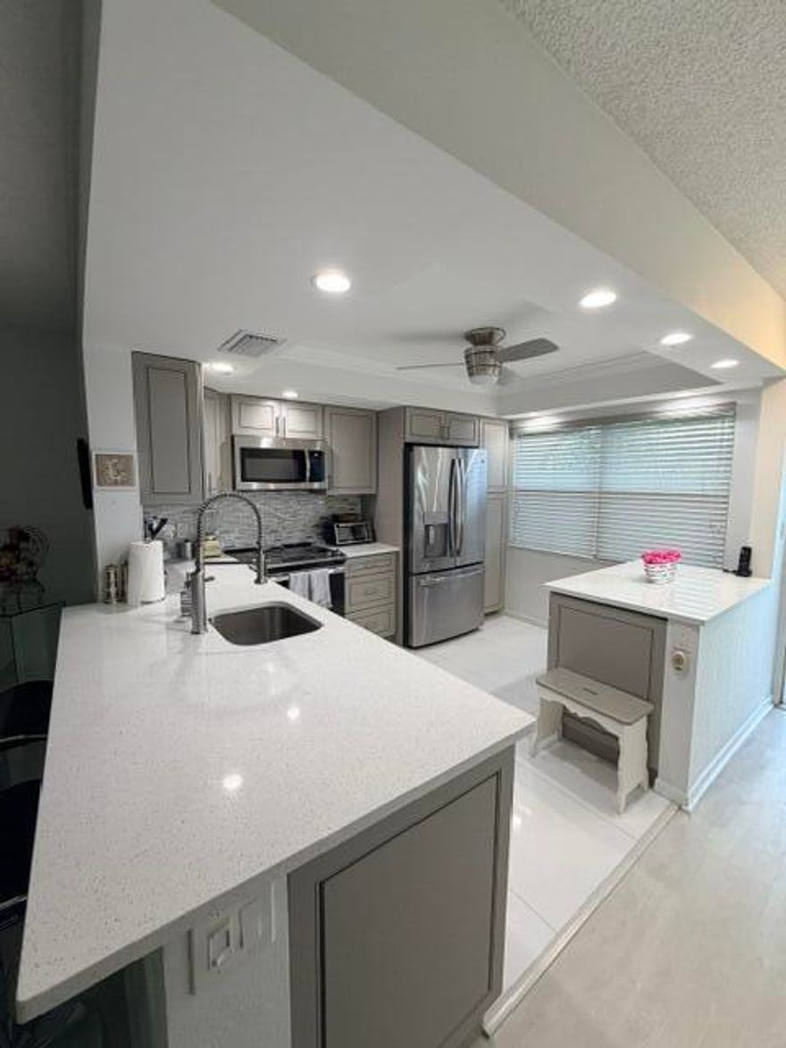 Beautifully remodeled kitchen and bathrooms featuring an open pass-through to the dining area. Stainless steel appliances including a wine cooler. The bathrooms are nicely updated as well.  The property is fully furnished or can be unfurnished. Overlooking the golf course.  HVAC replaced in 2021.   HEATED SWIMMING POOL*WYNMOOR COUNTRY CLUB FEATURES: IN HOUSE MOVIES & LIVE SHOWS ON SATURDAY NIGHTS WITH DANCING AFTERWARDS IN THE WEST WING OF THEATRE*18 HOLE EXECUTIVE GOLF COURSE.*TENNIS/PICKLEBALL COURTS, BOCCE COURTS, STAINED GLASS, CERAMICS, POTTERY, ART STUDIO, GLASS KILN, ZUMBA & WATER AEROBIC CLASSES, BILLIARD/POOL CENTER WITH HEATED BILLIARD TABLES, PING PONG, SAUNA, RESISTANCE WALKING POOL*SHUTTLE BUS SERVICE*OVER 90 CLUBS TO MEET NEW FRIENDS*962 THEATRE WITH DOLBE SOUND SYSTEM