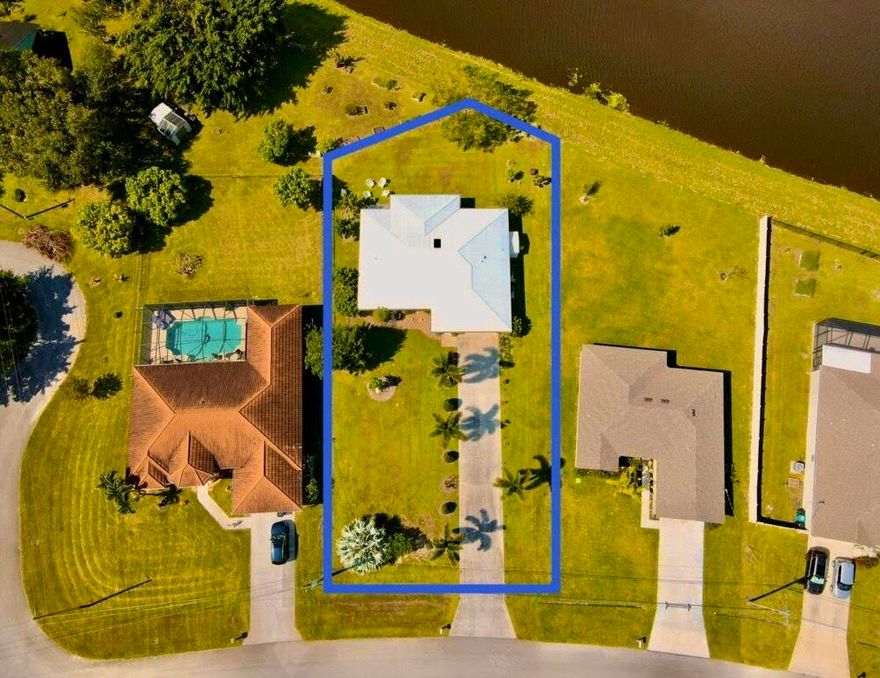 This beautiful home is in move-in condition.  There are so many unique features.  The home sits on one of the deepest lots in this neighborhood on a wide fresh water canal with a city green belt that provides excellent drainage.  If you have a number of vehicles,
maybe a motor home, boat on a trailer, or RV, there
is so much extra parking and room for a extra turnaround pad.  Entire home including the Florida Room has a Metal Roof.   Covered and Screened front entry porch, Kitchen features all stainless appliances including a bottom freezer.  The is also a skylight and
tile backsplash. New 2025 Garage Door Opener, the mature professional landscaping is exceptional.  Take the 45 plus HD Photo Tour and call for an appointment today... All new guest bathroom in 2020, with custom tile, a Spa Jet Tub
and much more-see photos.
Garage has one entire wall all with storage shelves...