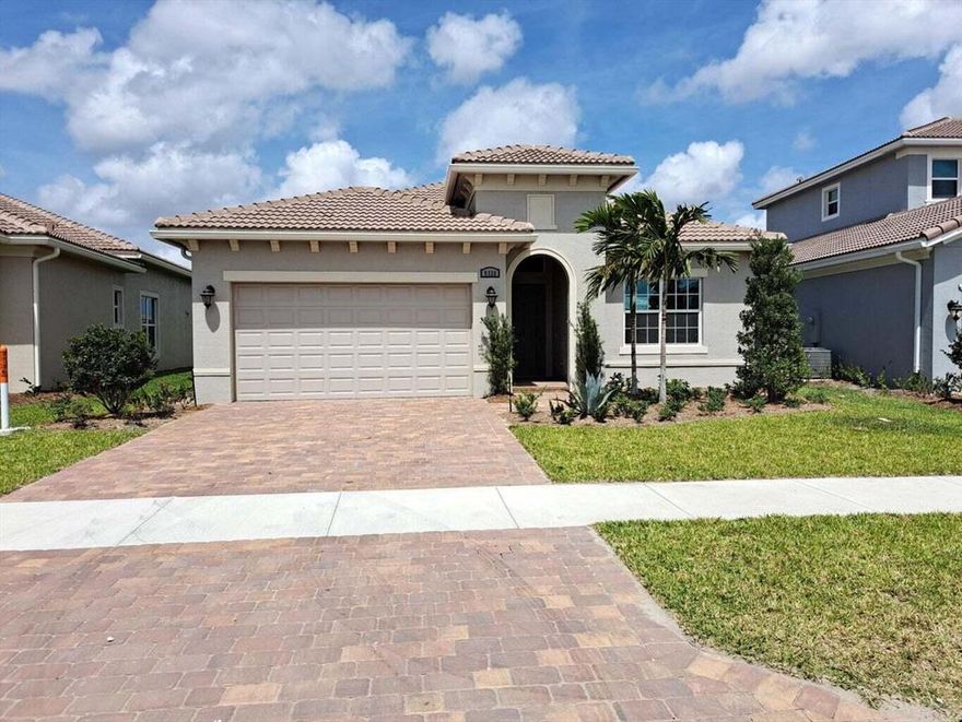 Seller Financing. 10 years fixed 3.5% with 30% down. Brand new, most desirable LAGO model on premium wide lake lot with tons of upgrades. Bright and airy, soaring ceilings with crown moldings, smooth finish walls, porcelain flooring throughout, open kitchen, granite counter top and backsplash, stainless steel appliances, walk in pantry and long eat-in center island. All window, sliders and doors are hurricane impact glass, covered patio, epoxy coated garage floor. Internet, cable, lawn care and amenities included in monthly maintenance. Luxurious all-inclusive resort style amenities, state of the art fitness center, aerobics studio, sauna and in-door heated Olympic pool and hot tub. Pickle-ball with 27 courts! Five tennis courts, 2 bocce and basketball, billiard room, movie theater