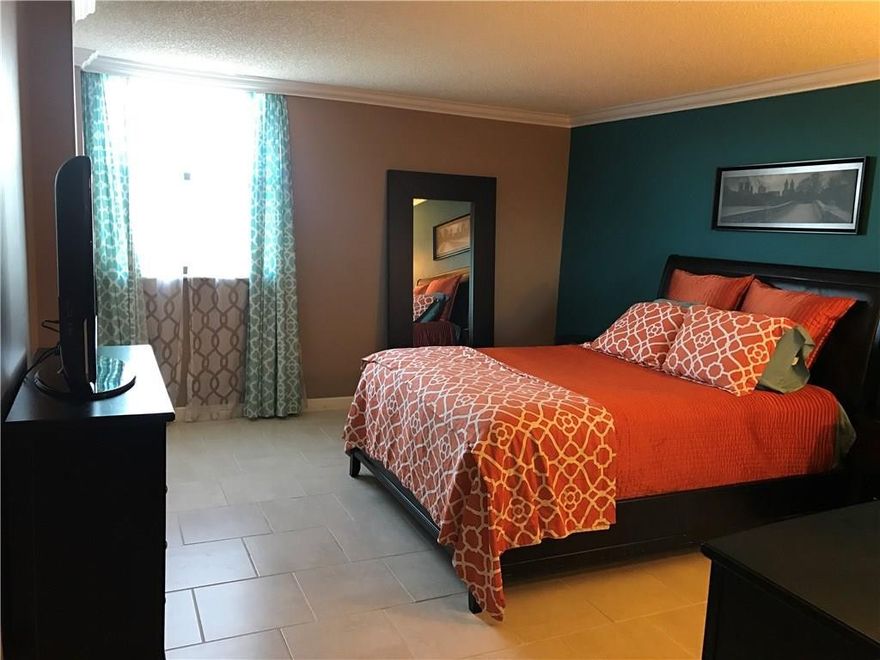 This large 2bedroom condo in Boca Del Mar is bright & light throughout w/great views of Boca Raton in ALL rooms. Remodeled kitchen w/custom built-in pantry, marble backsplash & large travertine floors. Stainless appliances & custom painted & plastered recessed kitchen ceiling w/crown molding & recessed lighting. Spacious living room & dining area & sliding glass doors that leads to the huge balcony. 13 x 16 master bedroom w/double-entry walk-in-closet, new modern-offset large tile flooring & crown molding