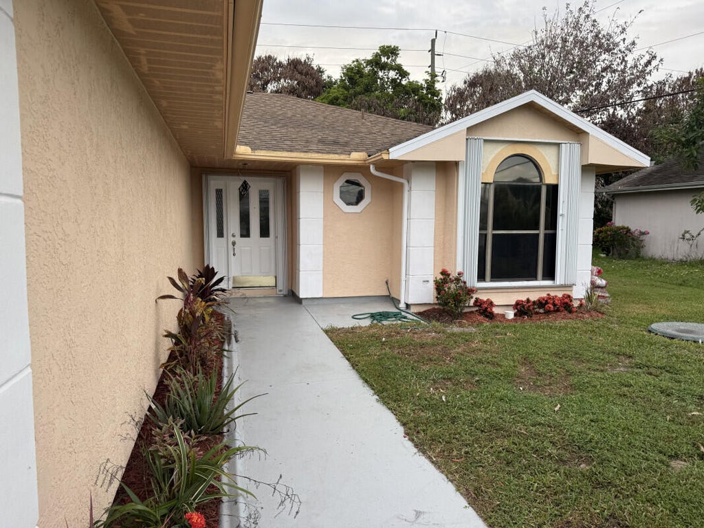 Photo of 3053 SE Wake Road, Port Saint Lucie, FL 34984 (MLS # B26043969)