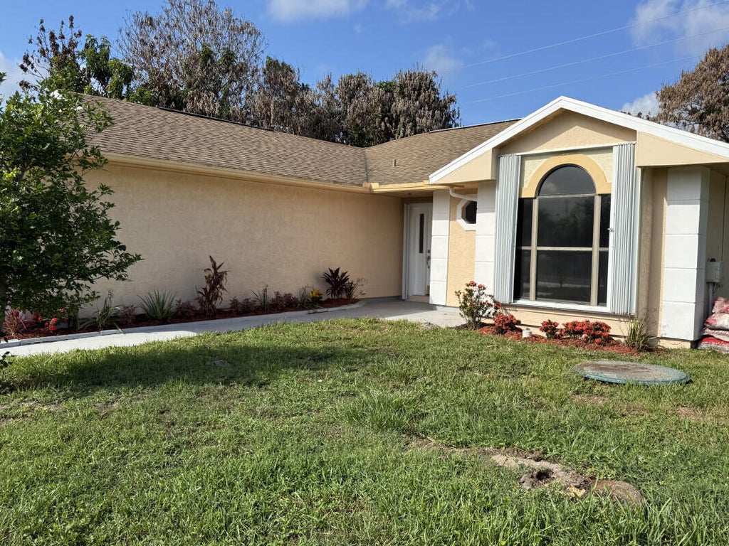 Photo of 3053 SE Wake Road, Port Saint Lucie, FL 34984 (MLS # B26043969)