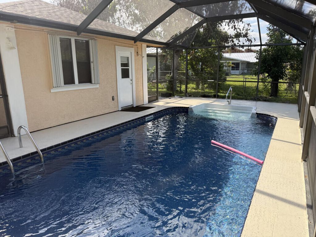 Photo of 3053 SE Wake Road, Port Saint Lucie, FL 34984 (MLS # B26043969)