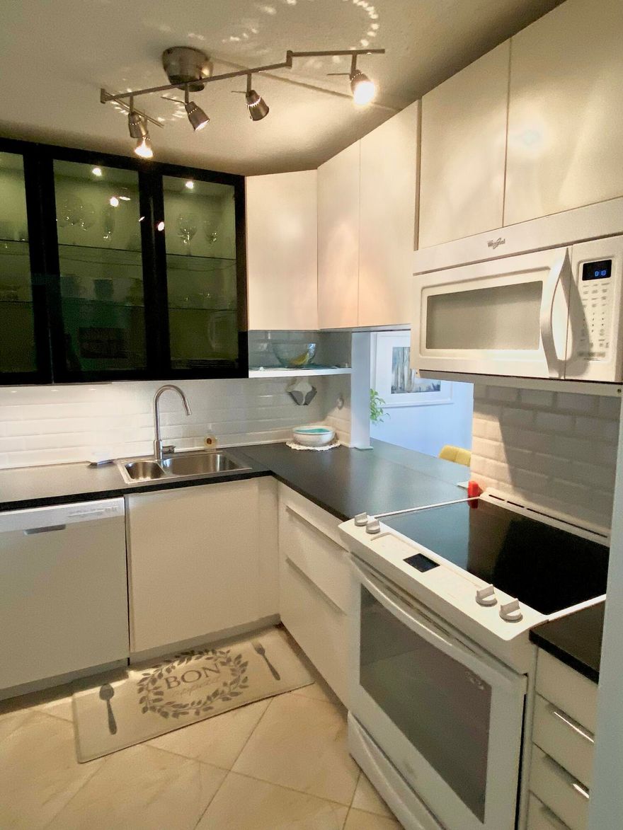 Beautiful updated, spacious waterfront condo in 55 plus active community!

Just minutes to the Atlantic Ocean and Palm Beach!

Leave those cold winterry days behind and own your own PARADISE in South Florida, Palm Beach County!

Newer modern kitchen, with soft close cabinets. Newer appliances. Updated, modern bathroom. Newer neutral flooring and walls throughout. (furniture included)

Convenient to all major retail and shopping as well as major interstate, I95

West Palm Beach downtown and beaches are just 20 minutes away!

Hurry, don't miss out on this incredible opportunity to relax in S Florida sunshine!

Bring your offer today!