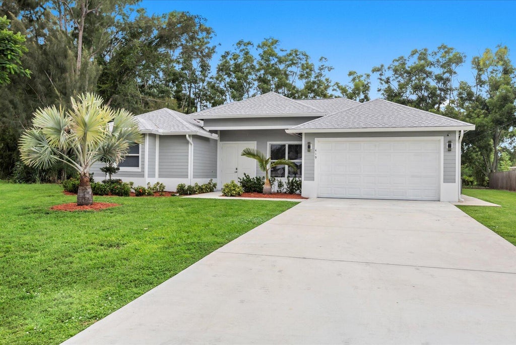 Photo of 419 SW Namoit Place, Port Saint Lucie, FL 34953 (MLS # B26079090)