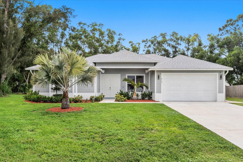 Photo of 419 SW Namoit Place, Port Saint Lucie, FL 34953 (MLS # B26079090)