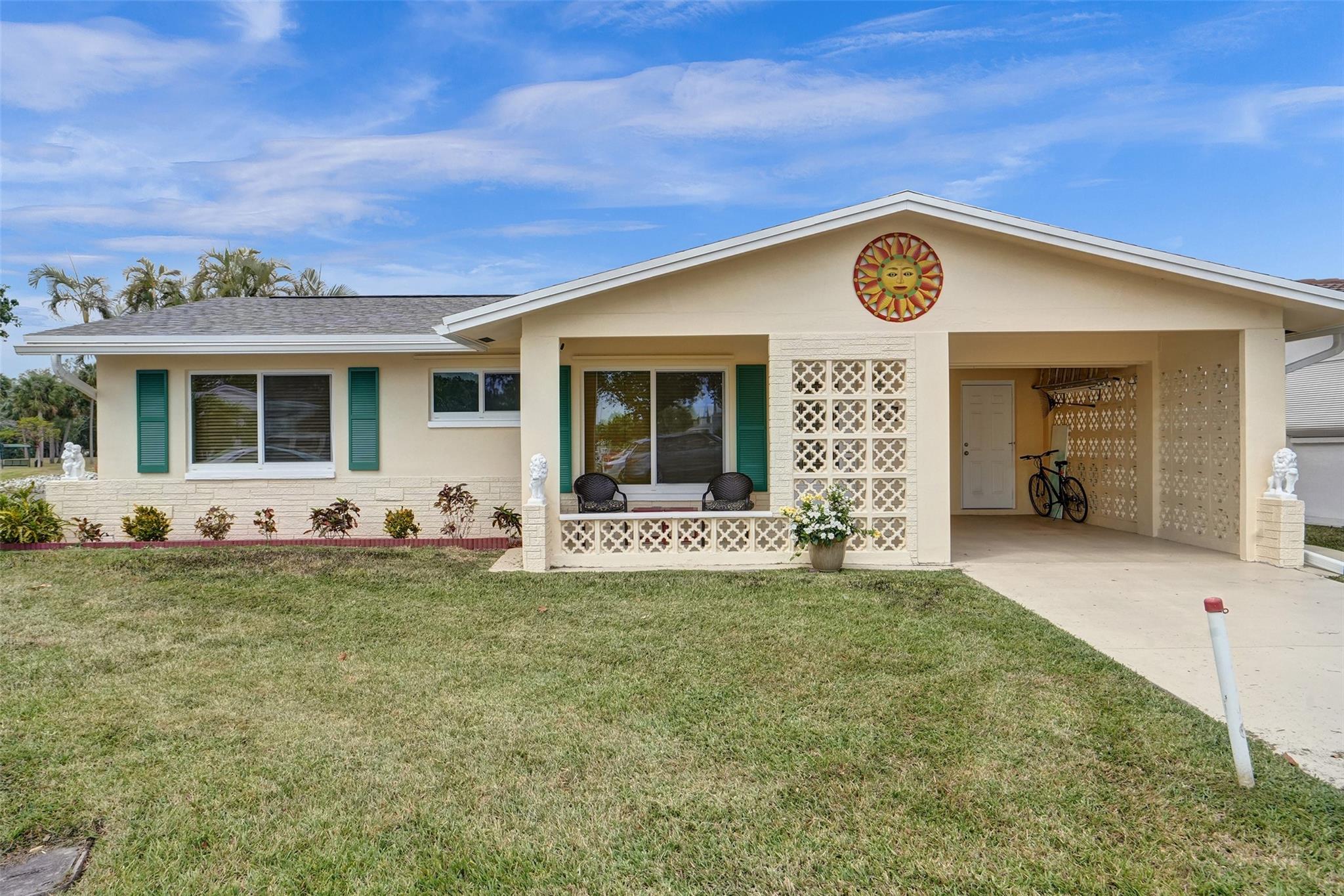 Discover your dream home in the vibrant 55+ Mainlands of Tamarac, with STUNNING CANAL VIEWS!! This beautifully updated residence features a stunning white kitchen with stainless steel appliances, complemented by elegant travertine flooring throughout. Enjoy peace of mind with impact glass windows and a brand-new roof installed in 2024. The energy-efficient tankless water heater adds modern convenience to your lifestyle. Relax and unwind while taking in the serene canal views from your backyard. This home is truly a gem—come see it today and make it your very own! Don’t miss this opportunity for a fabulous Florida lifestyle!
