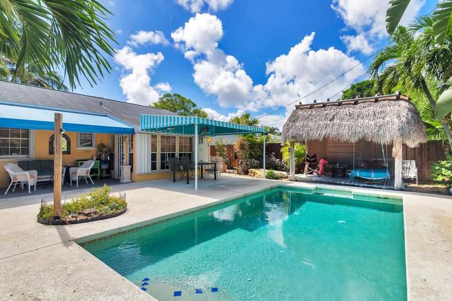 Lovely Old Florida style cottage with pool available for an annual unfurnished lease in SoSo! 2 bedrooms plus a bonus room, 1 full bath, sparkling swimming pool and tiki hut for the perfect fun in the sun backyard.Key West style home has charm from the original hardwood floors and gorgeous decorative fireplace mantel down to the white picket fence. Open living and dining areas have a breakfast bar into the kitchen and flow into the sunny Florida Room with saltillo tile and a tongue & groove ceiling with views overlooking the tropical pool area and fenced backyard. Upitchen is updated with white cabinetry and stainless steel appliances including a gas range for chefs. Full-sized laundry in bonus room. Amazing opportunity for a pool home in SoSo at a reasonable price.