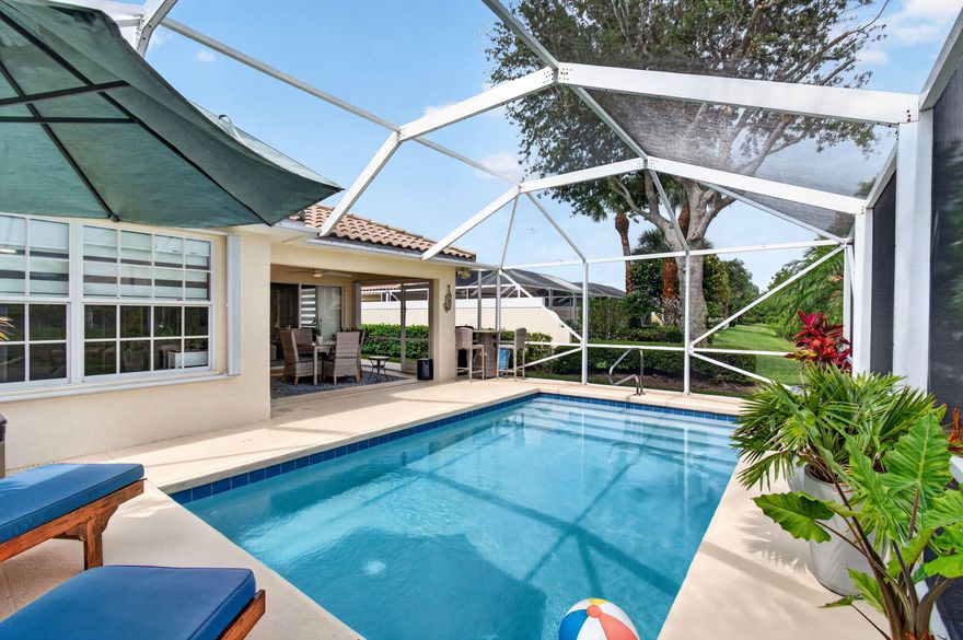 Lake view • Heated screened pool • Renovated Capri model • 1,540 sq ft • VillageWalk amenities • $540 monthly HOA  Set within VillageWalk of Wellington, this beautifully renovated Capri model brings together polished finishes, easy indoor-outdoor flow, and a peaceful lake-and-pool view. At 3023 Verdmont Lane, the home unfolds with porcelain tile throughout, vaulted ceilings, soaring built-ins, fresh interior and exterior paint, and thoughtfully chosen new light fixtures, ceiling fans, and window treatments. The kitchen sits at the heart of the floor plan with quartz countertops, stainless steel appliances, new light fixtures, recessed lighting, pot drawers, pullout shelving, and an open connection to the main living areas.  Sliding glass doors expand the living space to a covered patio and large screen enclosure, where the heated pool, 2022 pool heater, 2024 pool pump, and lake backdrop create a private-feeling outdoor retreat for sunset drinks and dining. The primary suite continues the view with a large walk-in closet with built-in shelving, a second closet for added storage, two linen closets, a renovated shower, quartz vanity, and dual sinks. Additional features include updated bathroom finishes, central vacuum, 2024 AC, 2026 water heater, complete accordion shutters, and a two-car garage with walk-up attic space and hanging storage shelves. VillageWalk's HOA is approximately $540 per month and supports a true lock-and-leave lifestyle, covering lawn and landscaping maintenance, a 24-hour manned gatehouse, in-home ADT monitoring, exterior home painting and roof cleaning, Xfinity services including internet and premium channels, and full access to all VillageWalk amenities. Zoned public schools include Equestrian Trails Elementary, Emerald Cove Middle, and Palm Beach Central High, with convenient access to Wellington shopping and dining, Whole Foods, Trader Joe's, the Mall at Wellington Green, Kaluz, Oli's, Agliolio's, equestrian venues, championship golf, beaches, and Palm Beach International Airport.
