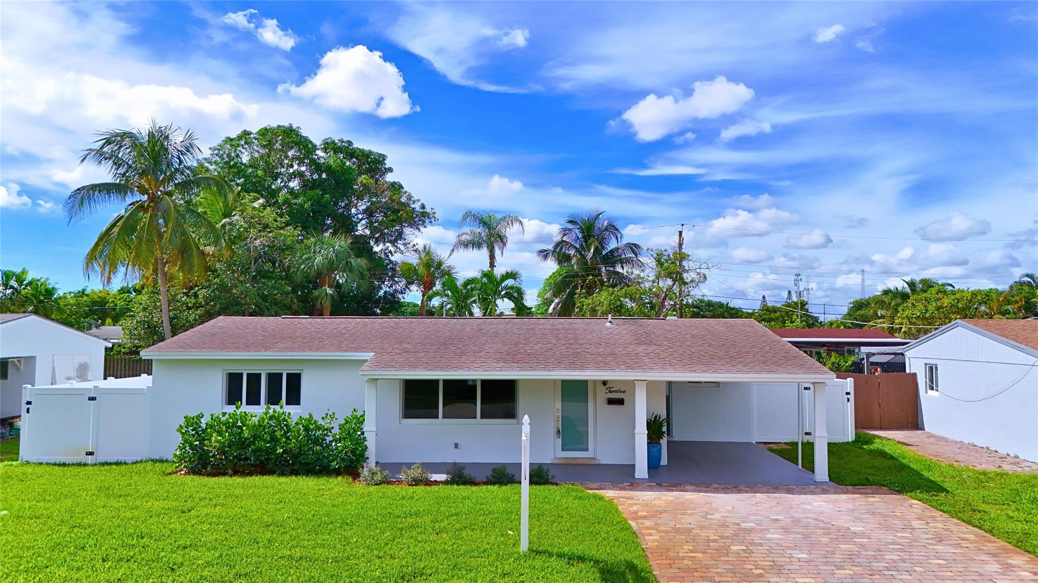 DEERFIELD BEACH - MINT 3-2 / Everything Brand New - KITCHEN - BATHROOMS - FLOORING - IMPACT WINDOWS. This Home has it all - Perfect Screened Patio overlooks Large Fenced Yard / Great Street with Sidewalks / There's nothing missing, even a Tankless Water Heater and so much more / EASY TO SHOW