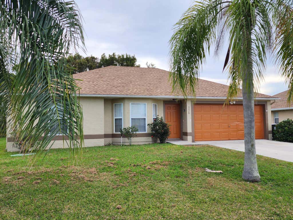 Photo of 326 SW Ray Avenue, Port Saint Lucie, FL 34983 (MLS # R10972242)