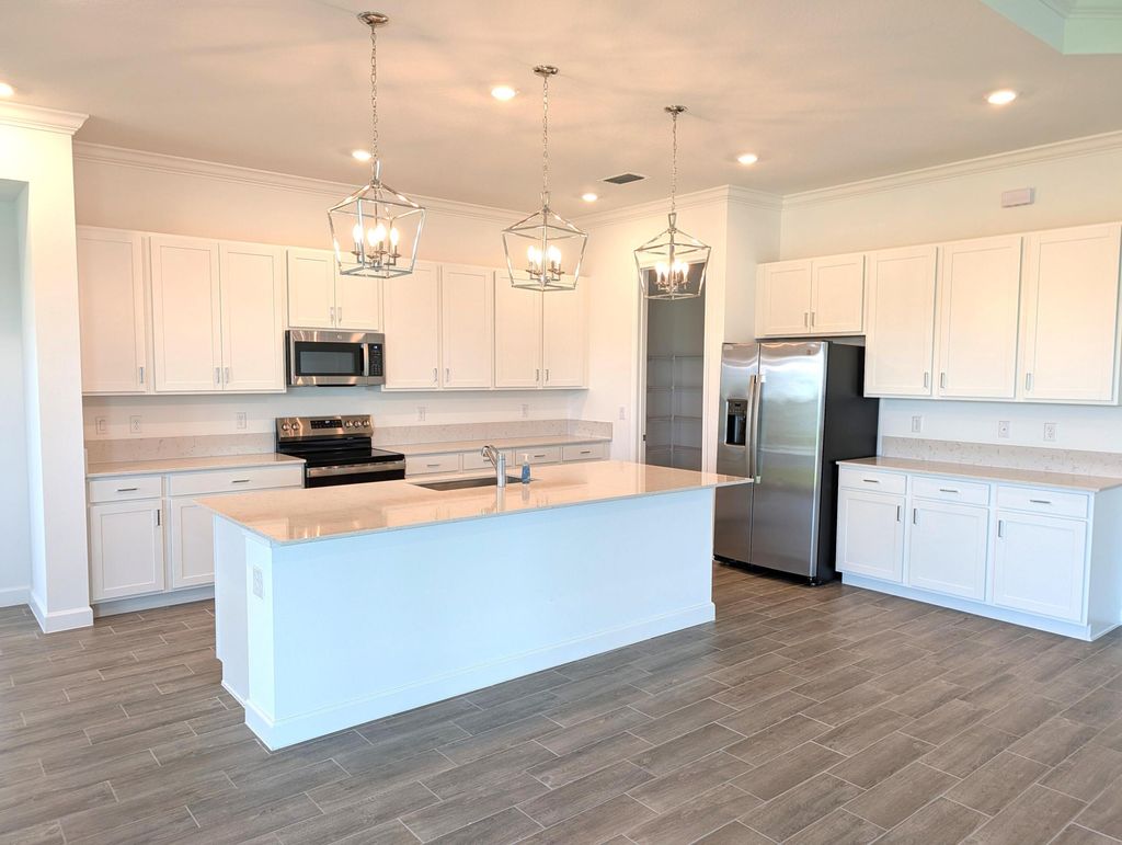 Photo of 1332 SE Willow Oaks Street, Port Saint Lucie, FL 34984 (MLS # B26027153)