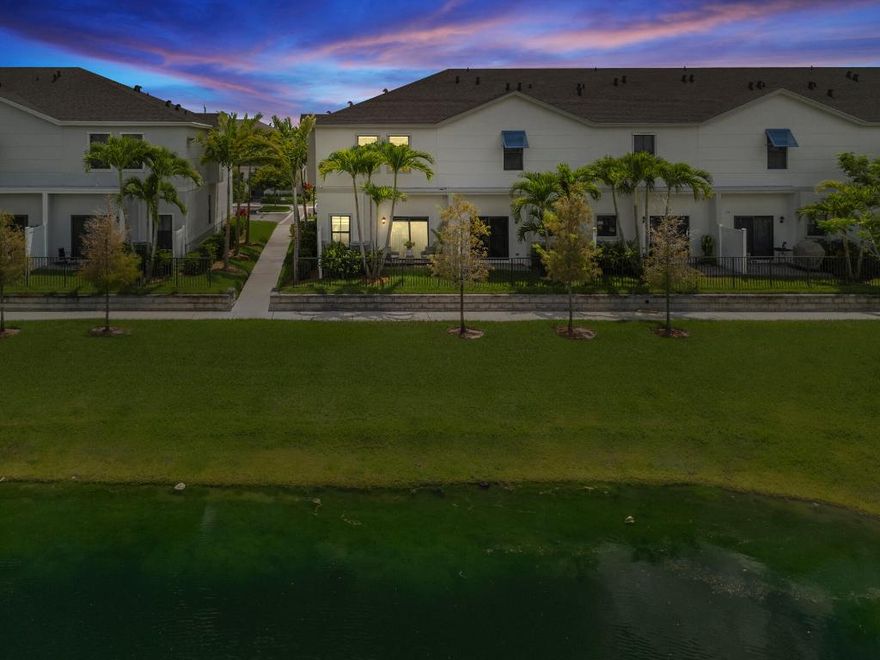 New construction lakefront corner unit completed at the end of September 2024. Minutes from the beach, this 1,719 sq ft 3 Bed 3 Bath residence is the biggest floor plan offered in the community. It features serene lakefront views and extensive upgrades throughout, with all standard builder-grade items fully upgraded. The kitchen, renovated in August 2025, includes extended quartz counters with a waterfall edge, matching backsplash, and a June 2025 upgraded refrigerator. Upgraded bathrooms feature stone finishes and a frameless glass shower in the primary. Designed as a smart home with integrated automation, 360° security cameras, zebra blinds, tankless water heater, low HOA fees, premium finishes, and a one-car garage. Low-maintenance modern lifestyle near beaches, shops, and dining!