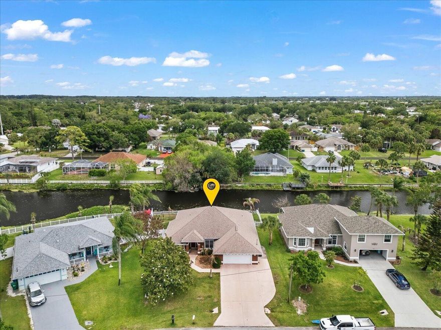 Experience the perfect blend of waterfront tranquility and modern efficiency.  A meticulously maintained CBS-constructed home built in 2002 on a quiet Sebastian canal. This residence features a private dock and kayak launch within a fully vinyl-fenced backyard, ideal for peaceful afternoons on the water. The interior shines with luxury vinyl plank and tile flooring throughout, complemented by elegant wainscoting and a gourmet kitchen with maple cabinets and stainless steel appliances.  New roof (2022), A/C (2021), and fresh interior and exterior paint (2025). Most notably, the newly installed solar system provides incredible energy efficiency with utility bills as low as $25 per month, and the seller will pay off the solar panels in full at closing.