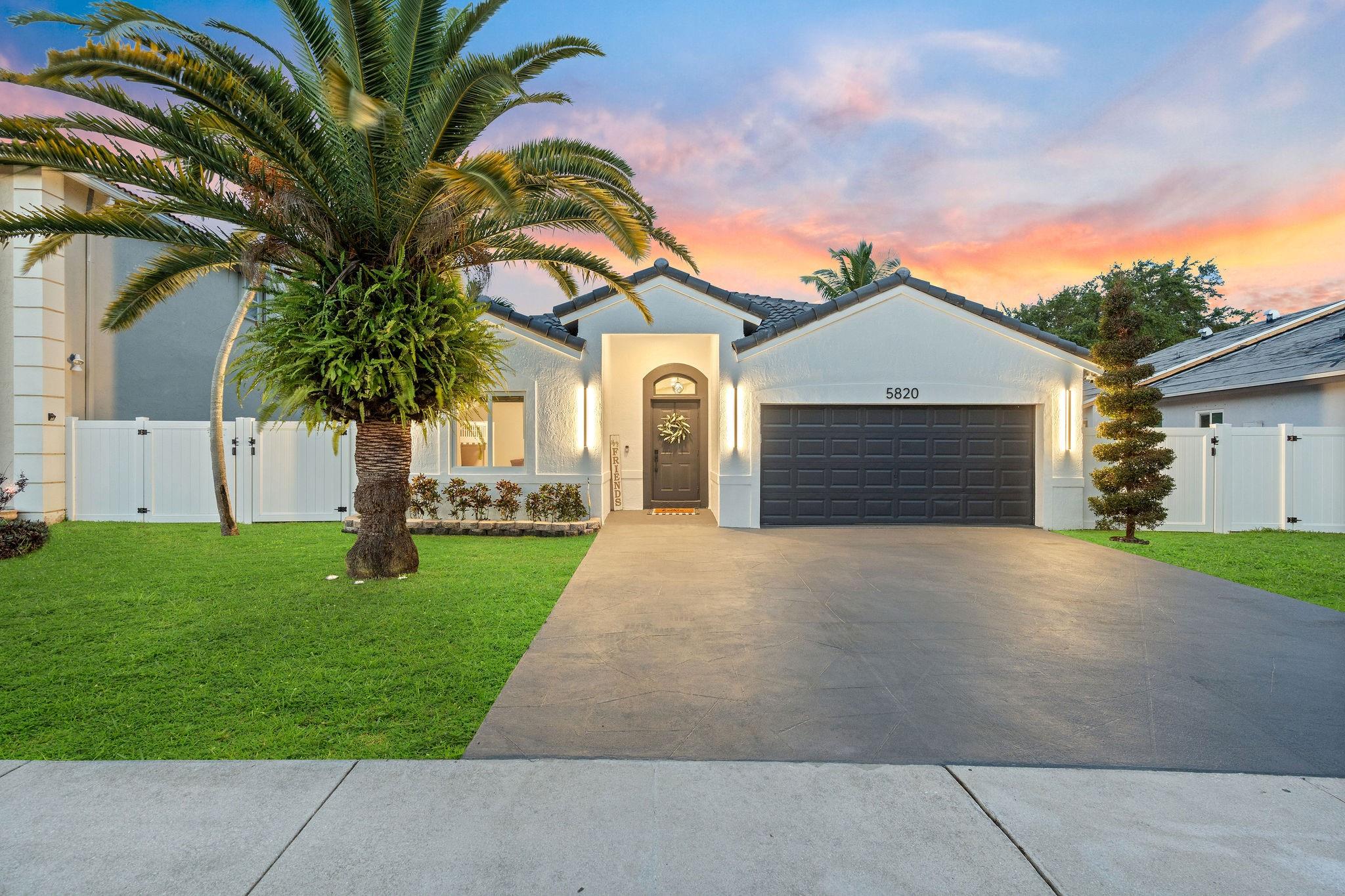Discover one of the nicest turnkey homes in Stirling Palm Estates, fully renovated and move-in ready. This 3 bed 2 bath gem sits on one of the largest and most private lots with no through traffic. Upgrades include a new roof, impact windows and doors, a remodeled pool and deck with fire pit, outdoor kitchen, Tesla PowerShare home battery back-up, patio awning, and exterior lighting. Inside, enjoy custom wainscoting, LED lighting, an open-concept layout, updated appliances, and a built-in bar perfect for entertaining. The home also features a/c garage, Tesla charger, and modern finishes throughout. Located in a quiet, family-friendly community of just 70 homes with top-rated schools, scenic parks, and nearby police and fire services ideal for those seeking comfort, and peace of mind.