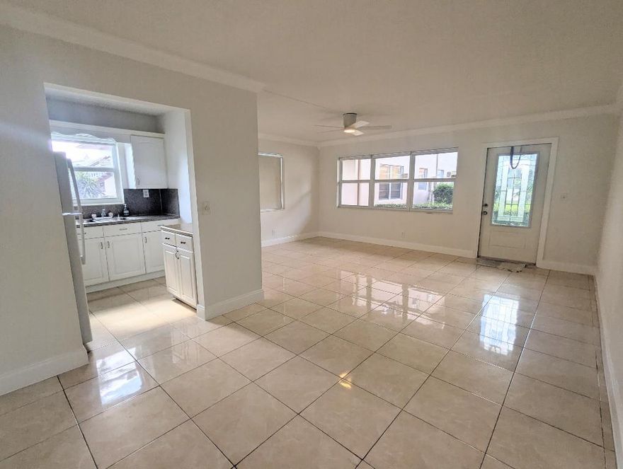 55+ CENTURY VILLAGE! Beautifully Updated FIRST FLOOR CORNER 1/1.5 With Upgrades Throughout! Gorgeous Updated Kitchen. Updated Baths, Bedroom has Ensuite Bath. Tile floors Throughout. Upgraded Lighting Fans, and Freshly Painted with New Blinds Full Hurricane Protection W/ Updated Front Door. New AC (2022). Building Features A Resident Patio. Fantastic Location near Somerset Pool and Tennis Courts. Century Village is a 55+ Resort Style Gated Community with Courtesy Transportation, Tennis, Pickleball, Shuffleboard, Theater Entertainment & Movies, Clubhouse, Fitness Center and Many Outdoor Pools. Come Enjoy Florida Living. Located near Turnpike,Shopping, Beaches and PBI Airport.