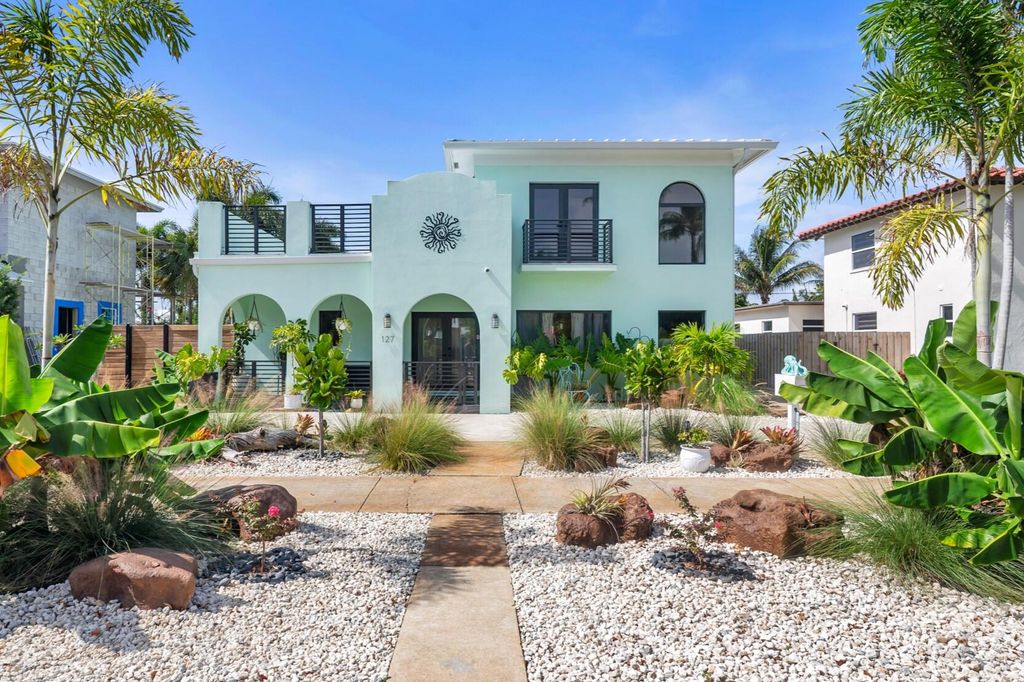 Photo of 127 Auburn Drive, Lake Worth Beach, FL 33460 (MLS # B26049243)