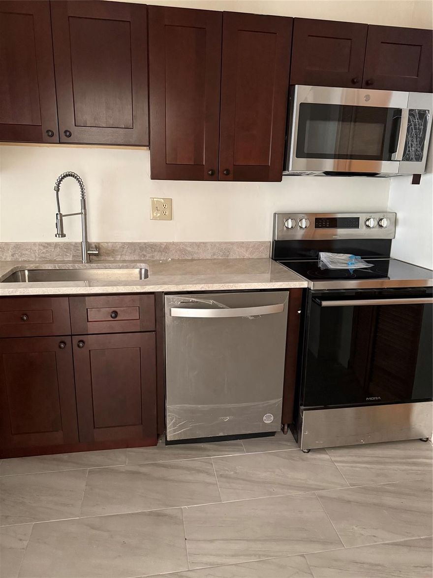 SPACIOUS 2/2 WITH PEACEFUL WATER VIEWS, NEW APPLIANCES, NEW TILE, UPDATED KITCHEN AND BATHROOMS AND FRESH PAINT THROUGHOUT