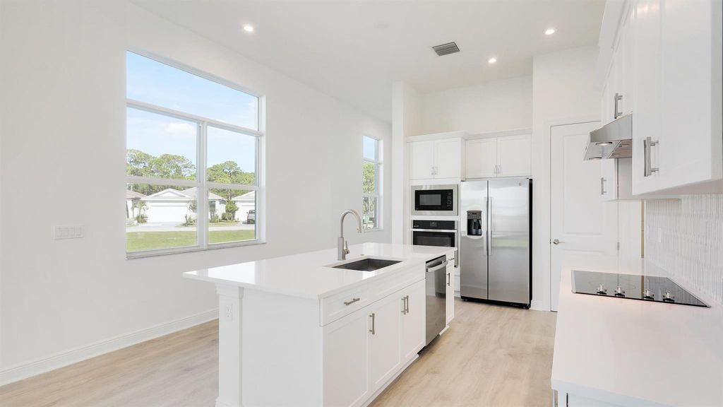 Photo of 161 SE Via Sangro, Port Saint Lucie, FL 34952 (MLS # R10943024)
