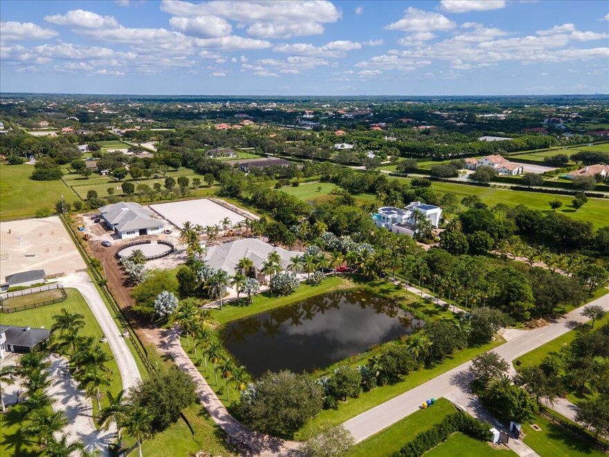 The ultimate seasonal rental at a premier farm in the gated community of Palm Beach Point.Ideally situated within walking distance of Wellington International, this property boasts exceptional equestrian facilitiesSeasonal Price: $12,000 per stall for season. Main house $20,000 per month. Main house 5-bedroom home. 12 stall barns Laundry room. 2 separate feed rooms.2 separate tack room. 2 separate grooming stalls.2 separate washing stalls.Large riding arena with all-weather footing (GGT footing). Round Pen.5 grass paddocks with high fencingRiders loungeParking for trailers and cars.