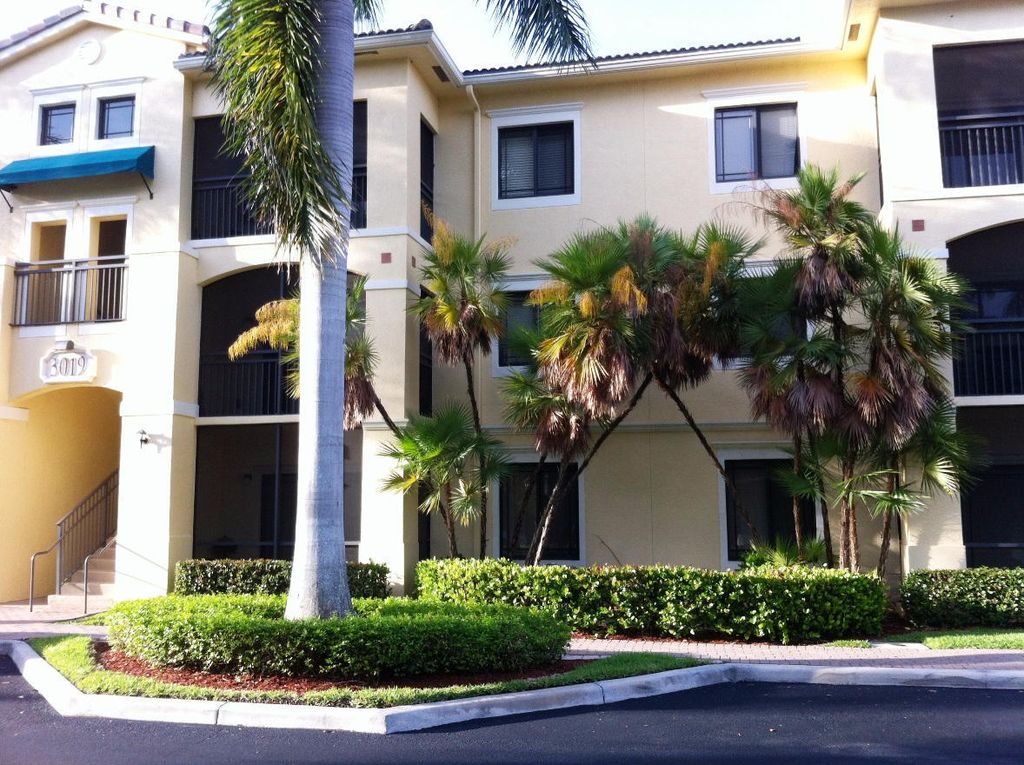Photo of 3019 Alcazar Place #Apt 102, Palm Beach Gardens, FL 33410 (MLS # B26020645)