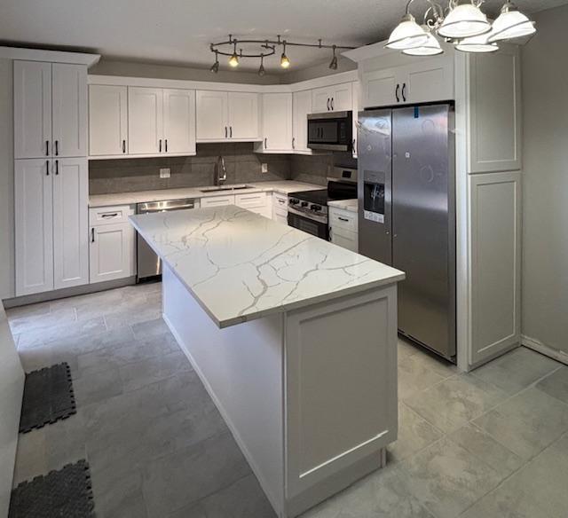 Beautifully renovated 2 bedroom 2 bath townhome in Meridian Park at Sandalwood in Palm Beach Gardens. Brand new kitchen cabinets with Quarts countertops and a custom island like no other! Brand new bathrooms and tile flooring throughout.