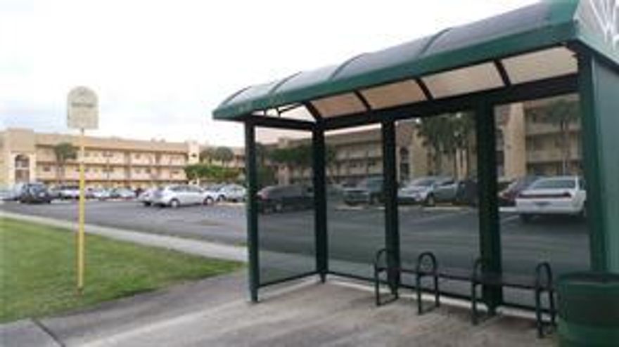 Substantially remodeled First Floor Corner Unit, Completely Tiled thruout. Overlooking Canal , Enclosed Patio , Pools, Courtesy Bus, Laundry Facilities. Very Active Senior Community