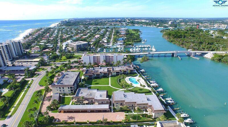 Intracoastal and Jupiter Lighthouse views. Enjoy the ultimate boating lifestyle with a private dock and lift for up to a 26' boat, plus kayak and paddleboard storage with direct water access. Neutral, inviting interiors and a bright open floor plan maximize the views from this 2nd-floor residence. Stroll the beach path, bike to shops, or walk to restaurants--all just minutes away. Waterfront living with dock, lift, and lifestyle all included.