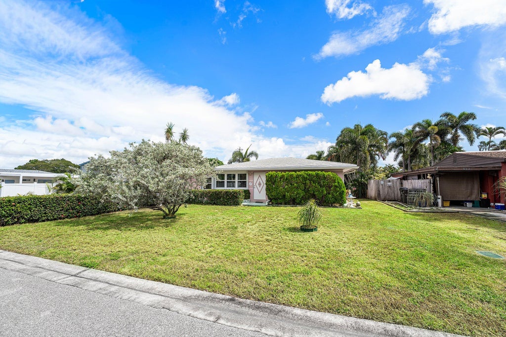 Photo of 418 VIRGINIA Drive, Lake Worth Beach, FL 33461 (MLS # B26091241)
