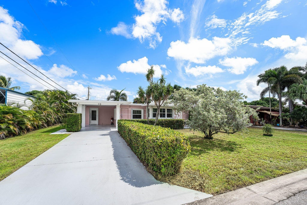 Photo of 418 VIRGINIA Drive, Lake Worth Beach, FL 33461 (MLS # B26091241)