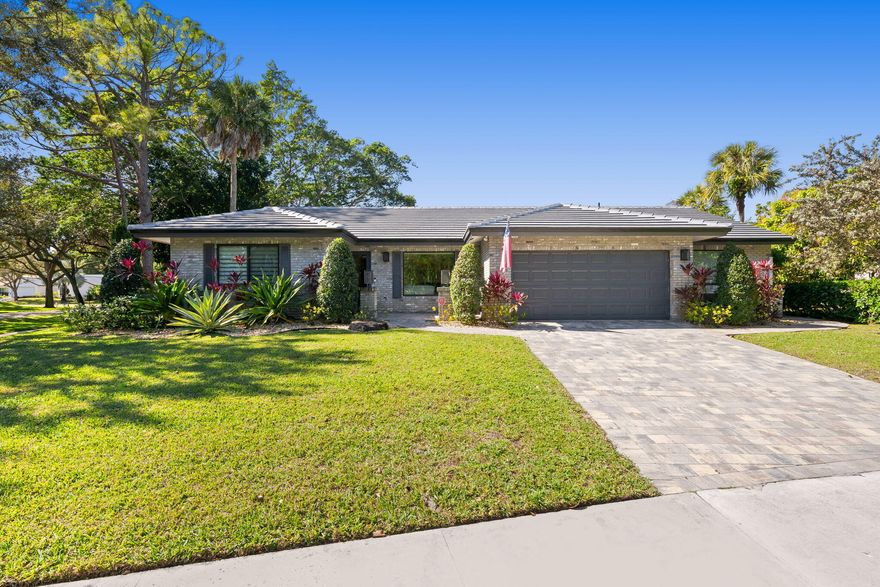 The wait is over! This home offers brand-new roof and new impact windows and doors, this 4-bedroom,3-bath home is set on a peaceful lake in Boca Raton's charming Timbercreek neighborhood and offers a rare combination of space, light, and serenity. The backyard is a true highlight, featuring a large pool and tranquil water views, all enjoyed from a spacious covered patio designed for relaxing or entertaining. Inside, the home is filled with natural light and thoughtfully designed living spaces.The kitchen features high-end appliances and beautiful lake views, while the living room is anchored by an electric built-in fireplace that adds character and warmth. The primary suite feels like a private retreat with a gorgeous bathroom and an oversized walk-in closet. Click 'more' for additional A generously sized laundry room and well-proportioned secondary bedrooms add to the home's functionality. Located in Timbercreekknown for its tree-lined streets and prime Boca Raton location close to top-rated schools, shopping, dining, and parksthis home delivers both comfort and lifestyle in a truly special setting.