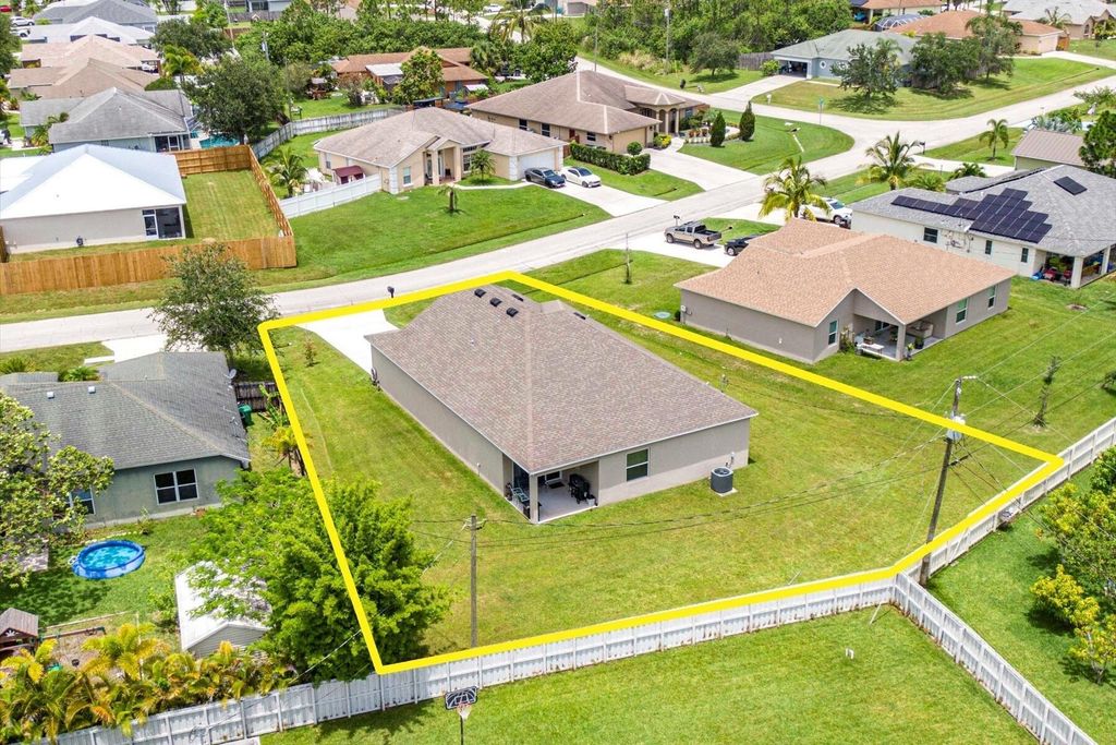 Photo of 2389 SW Vale Street, Port Saint Lucie, FL 34953 (MLS # R10997742)