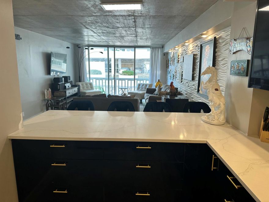 This spacious condo has 1 bedroom and 1.5 bathrooms with a large family room . New kitchen and appliances, . Large master bedroom. Unique polished concrete floors and ceiling Fully furnished. There is a full set of hurricane shutters. Barn doors condo is located close to the elevator and laundry. This property is right on the beach. Comes with a doorman, salt water pool, gym, his/her saunas and community room inside the building. Grassy area where you can sit down outside and enjoy the ocean breeze and views. Close to shopping, entertainment and dining