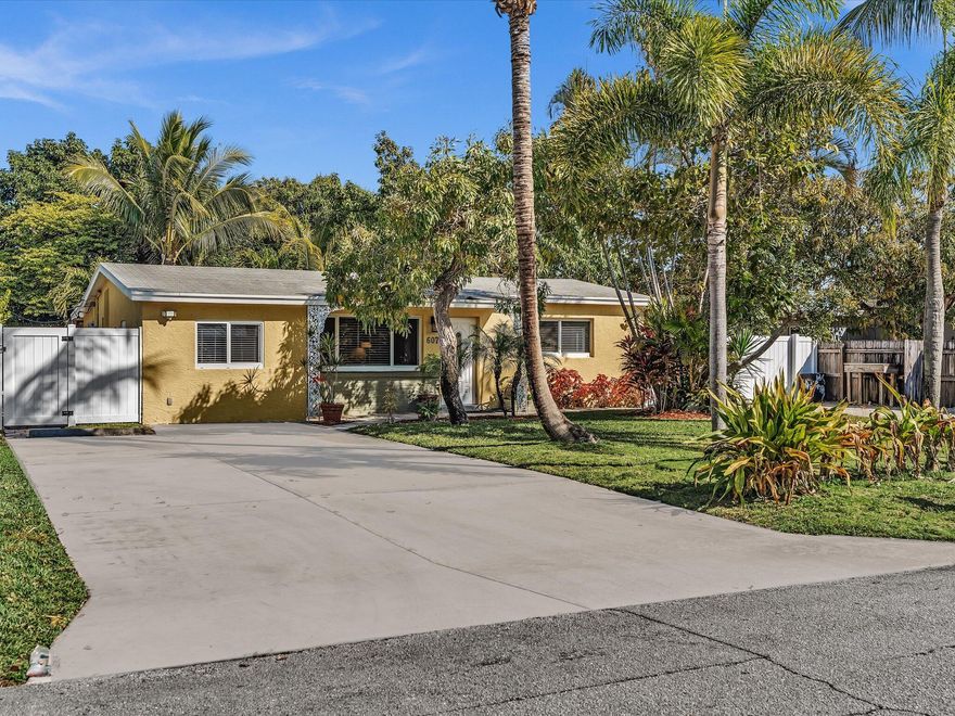 Rare opportunity in Lantana offering parking for up to 11 vehicles, including a securely gated side parking area with rear access for a large boat or RV — a level of flexibility rarely found east of I-95 at this price point.

This move-in ready 3-bedroom, 2-bath home features an updated kitchen with white shaker cabinetry, stainless steel appliances, modern backsplash, and stone countertops. A very large screened-in lanai provides ideal space for outdoor dining and entertaining.

Situated on an oversized 67' x 140' lot with room to expand or add a pool, the property offers exceptional versatility. Two expansive front driveways and the gated side pad allow storage for cars, boats, RVs, trailers, or commercial vehicles. Located just seconds from the Intracoastal, marinas, and the beach  and with NO HOA  this property combines location, land flexibility, and rare parking capacity in one unique offering.

Survey included outlining structure and lot dimensions.