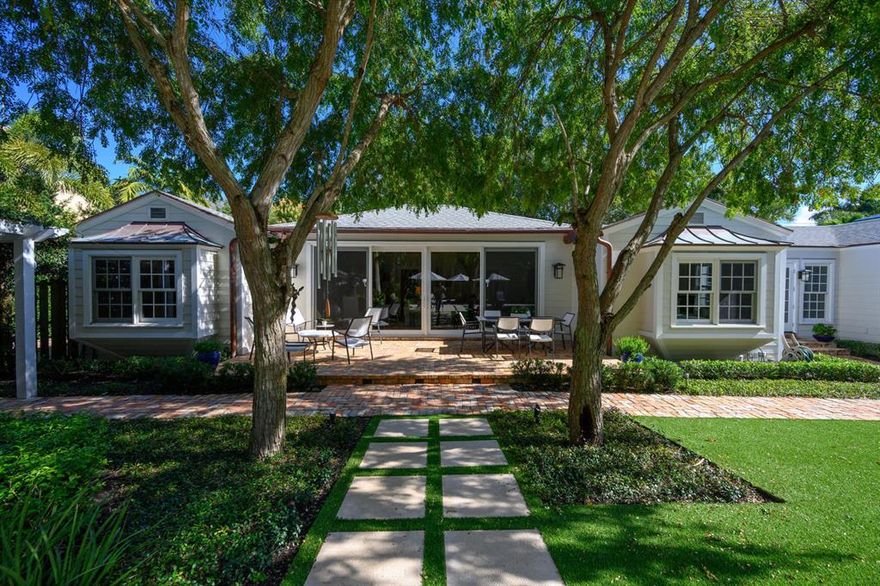 Beautifully renovated. A must see! 4 total Bedrooms, 4 baths. Natural Gas in from the street. Amazing landscaping and grounds. Lg back turf yard w/ putting green and tropical heated pool with sun shelf & auto fill. This home has all the charm of an old Delray home but with all new updates. Hardwood flooring, high ceilings, impact windows in main house and french doors. Wood & brick floors. Garage is Air Conditioned. Entire house is newly furnished and decorated. 2 D/W, 2 ovens.  Dream kitchen. Wolf 6 burner + griddle stove, sub zero refrig. Butler's pantry.  1 Bedroom sweet cottage on grouds.Located just west of the Intracoastal and is a short bike ride or walk to the Beach or Atlantic Ave.  You must see to appreciate.  Many more upgrades.  Available furnished negotiable.