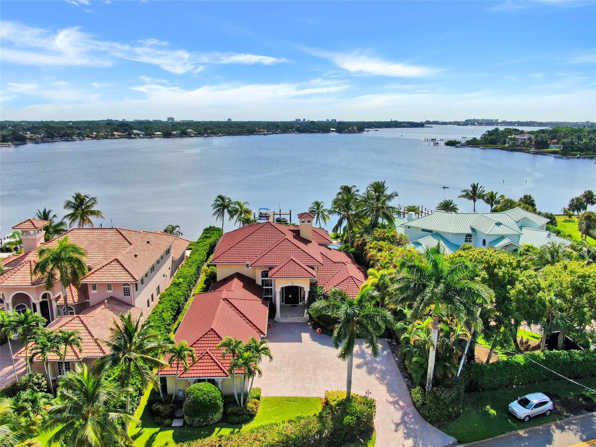 Stunning seasonal rental on the widest section of the Loxahatchee River with unobstructed water views all the way to the Jupiter Lighthouse. This fully furnished 4BR/4.5BA residence offers king beds and en suite baths in every bedroom, an open kitchen with adjoining dining and den, formal living and dining rooms, private office, cabana bath, large laundry, and 4-car garage. Enjoy the ultimate indoor-outdoor lifestyle with pool, dock, covered patio with BBQ and outdoor dining, fresh breezes from the river. Just minutes to Jupiter’s beaches, golf, fine dining and shopping. Home is very well equipped with large chefs kitchen, superior linens and furnishings. Pet Friendly.