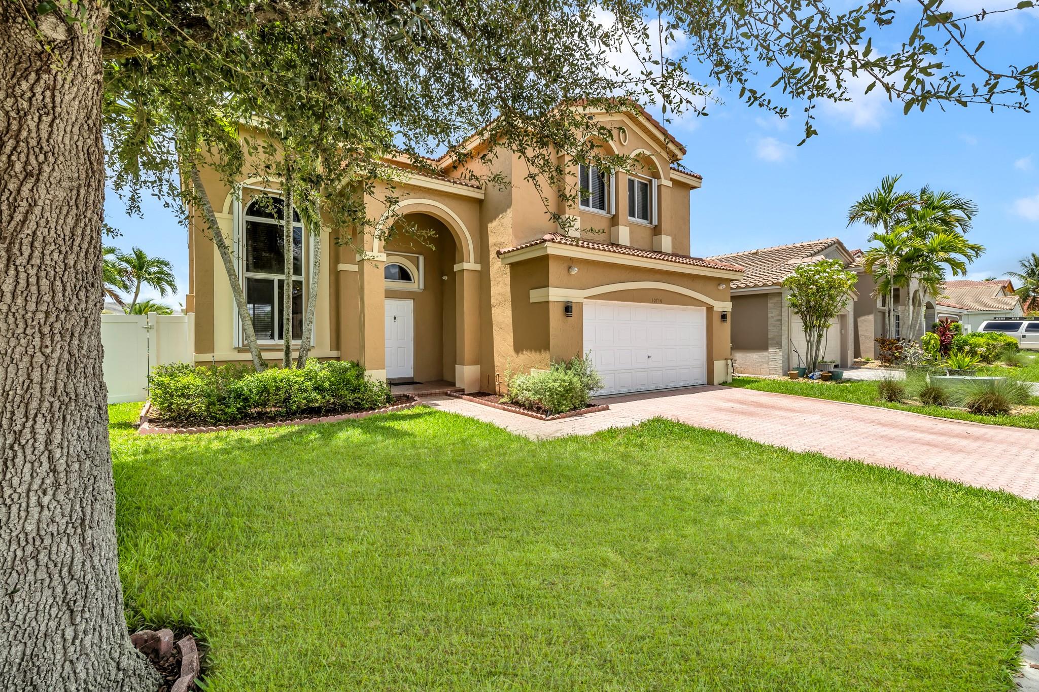 Stunning 4 bed, 2.5 bath home with a 2 car garage in the heart of Davie. Fully protected with impact windows and accordion shutters. Enjoy extra storage with custom cabinetry in the laundry room and garage. The spacious master suite provides a peaceful retreat, while the half bath on the first floor adds convenience for guests. A brand new fence offers added privacy and security. Located in a quiet, well-maintained community close to top-rated schools, major highways, shopping, dining, and parks. Low HOA and move-in ready. Whether you're looking to settle down or invest, this well-kept home offers comfort, value, and location. Don’t miss it—schedule your showing today!