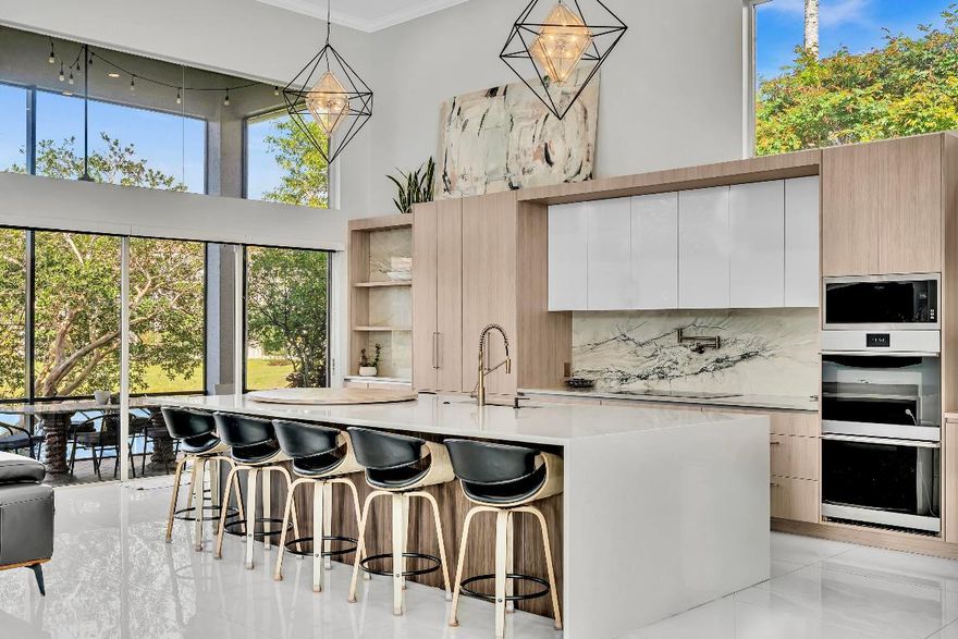 Magnificent one story courtyard waterfront home, located in the highly sought after family friendly gated community of Seasons In Central Boca Raton, along the famous '' Millionaire Mile.'' 
This elegant residence offers soaring ceilings and abundant natural light throughout with 3 bedroom, 3.5 bath in the main house and 1 bedroom and 1 bath in a separate guest house.
The floor plan is open & inviting, perfect for hosting lavish parties or relaxing w/family & friends. Smooth walls, smooth ceiling and large 4 x 4 porcelain tile flooring throughout.
The huge fully updated kitchen is a chef's dream featuring quartzite countertops, induction cook top, quartz island, modern cabinetry and stainless steel appliances. The 2-car garage and circular driveway offer ample parking and curb appeal Roof 2020
3 AC units 2025, 2018, 2018
Salt water pool has  LED lights and waterfall feature
Seasons is zoned for A rated schools: Calusa, OMNI & Spanish River High. Residents can enjoy the newly- renovated clubhouse, state of the art fitness center & heated resort style swimming pool.
Seasons is a luxurious 24-hour gated community. with 8 Har -Tru tennis courts, on-site tennis pro and pro-shop, excellent tennis programs for adults and kids, large renovated fitness center/gym, basketball courts, state -of -the art playground, plus a clubhouse and a party room. Conveniently located near the area's top private schools Pine Crest, St. Andrews, American Heritage and Donna Klein.