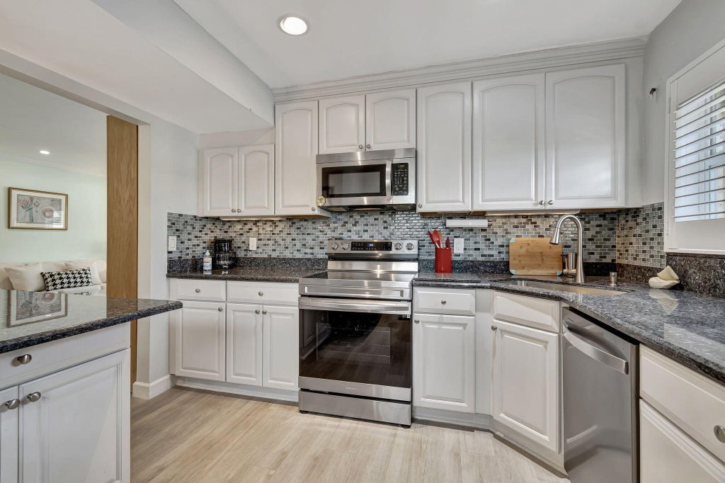 Photo of 9 Colonial Club Drive #305, Boynton Beach, FL 33435 (MLS # B26048682)