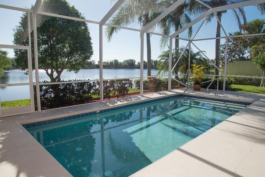 Enjoy gorgeous sunset lake views from your private screened pool and patio. Hard to find extended Oakmont model on quiet street in Lakes at Tradition has it all! Wide lake views, accordion hurricane shutters, newer AC, built -in wall storage, larger rectangle pool with new pump, side loading garage for extra parking, and all tiled living area! 2198 sq feet encompasses 3 bedrooms plus den, Corian kitchen with new dishwasher, refrigerator, disposal, faucet, and new carpet in den and master bedroom. Master suite has his/hers bathrooms, separate shower and spa tub, and tons of closet storage.  HOA fees include basic cable, internet, security alarm system/monitoring, all lawn maintenance, and exterior painting!Community amenities include: 24 hour manned gate, 2 heated swimming pools, tennis... Community amenities include: 24 hour manned gate, 2 heated swimming pools, tennis, basketball, fitness center, clubhouse, game/card room, playground, bocce ball and shuffleboard. Easy walk or bike ride to shopping and dining in downtown Tradition. Convenient to hospital, Gatlin Blvd, and I-95 for commuters.